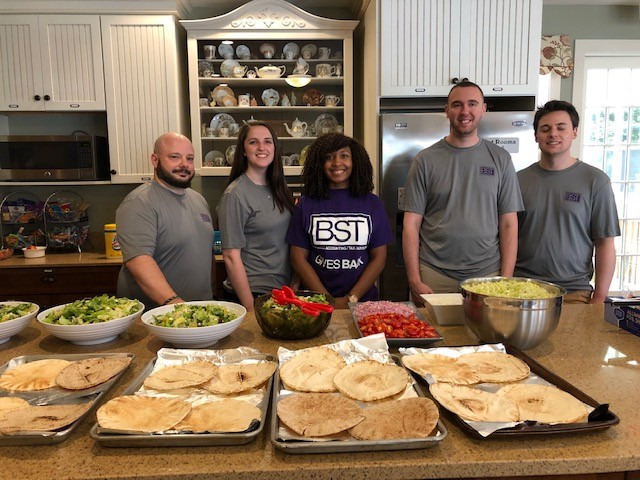 BST employees volunteer at Ronald McDonald House serving food